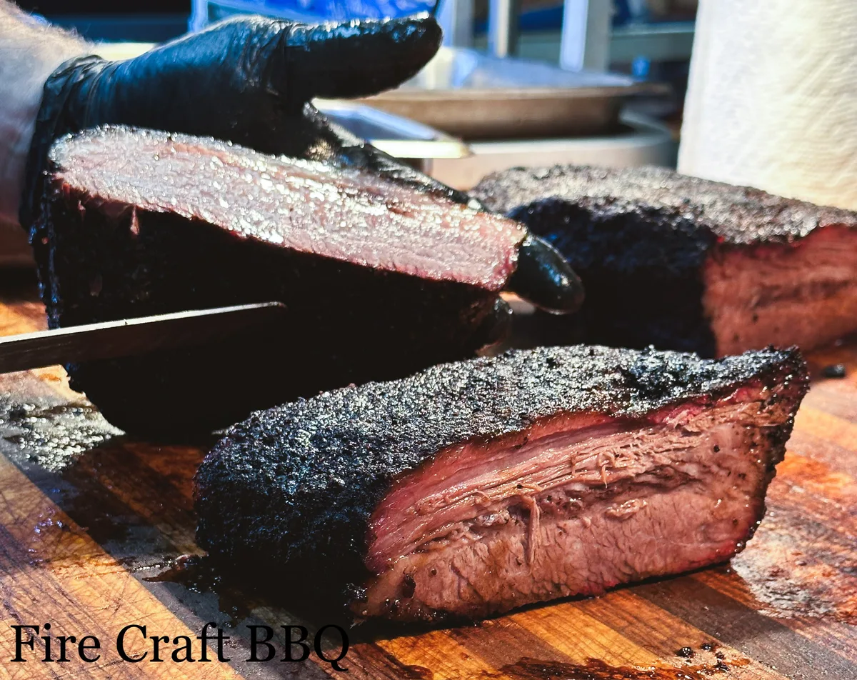 Sliced brisket with a dark bark and smoke ring