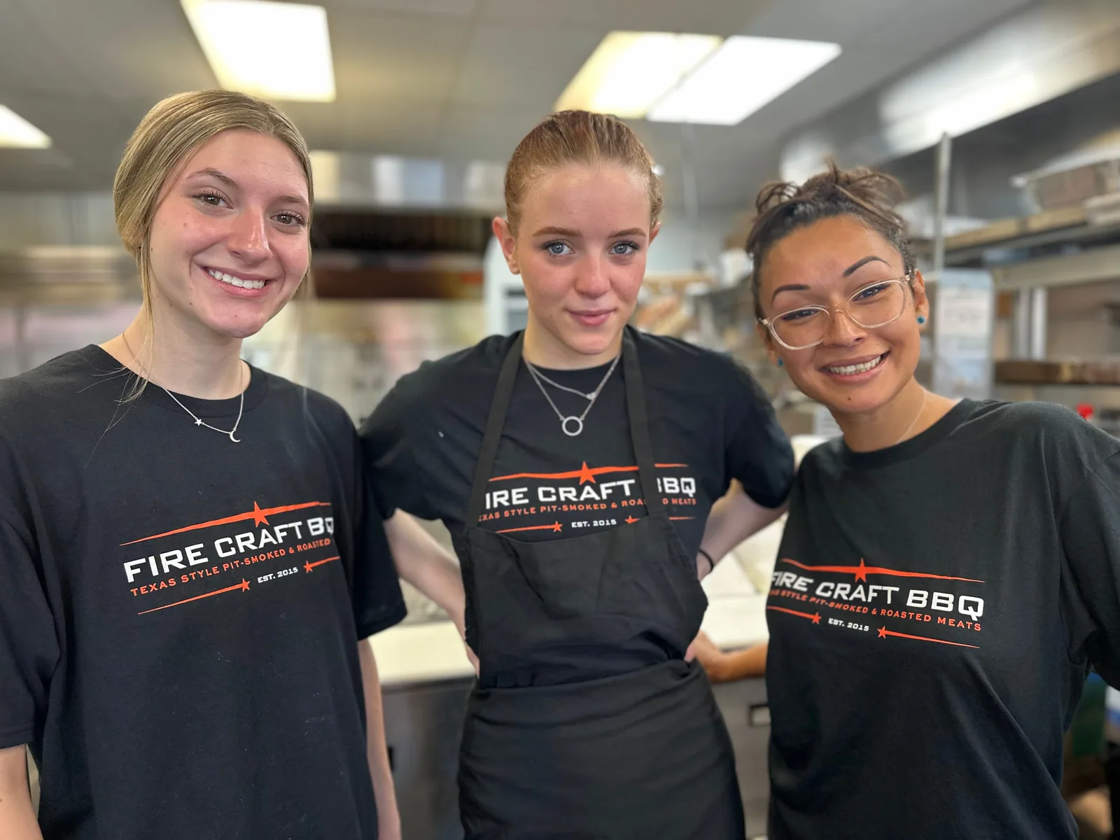 Three Fire Craft team members together in the kitchen