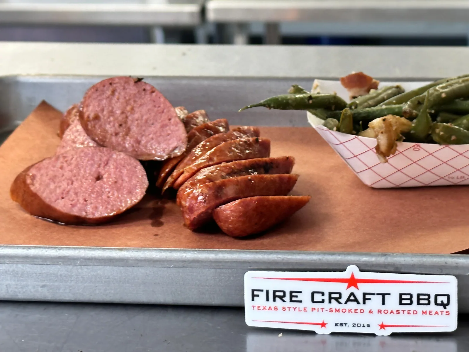 Slices of smoked sausage on a Fire Craft tray