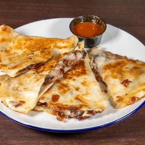 Fire Craft brisket quesadilla with dipping sauce