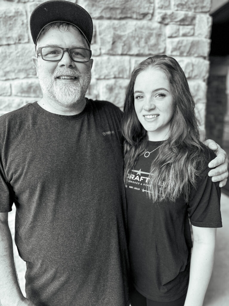 Chef David Welch with a member of the Fire Craft BBQ team